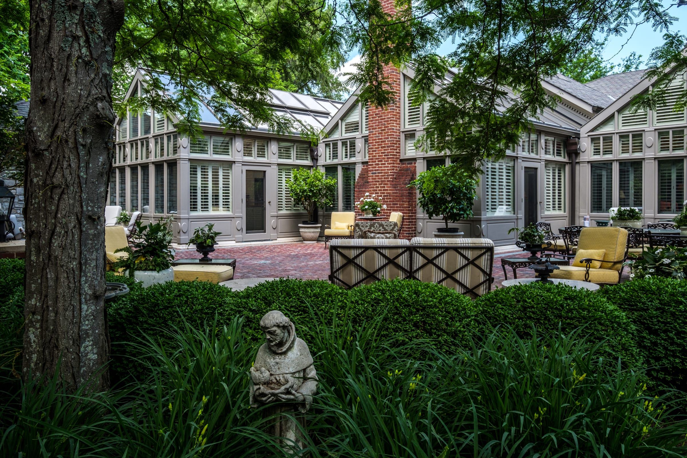 Conservatory courtyard and outdoor living at a Lakewood Drive estate